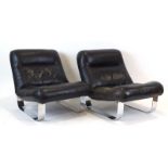 A pair of 1970's black leather lounge chairs on chromed slide frames