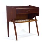 A 1960's Danish teak cabinet, the galleried surface over a single drawer and bergere tier,