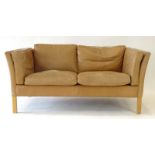 A Stouby tan leather two-seater sofa on square beech feet, l.