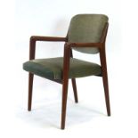 A 1960's Danish teak and upholstered elbow chair