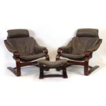 A pair of 1980's Skippers Mobler brown leather and bentwood lounge armchairs together with a