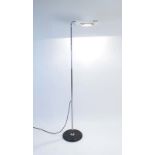 A 1980's standard lamp, the adjustable light within a white enamelled shade,