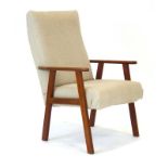 A 1970's fabric upholstered highback armchair with a beech frame
