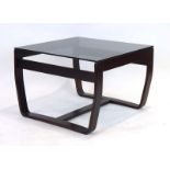 A 1970's Norwegian coffee table, the smoked glass surface resting on a bentwood frame, w.