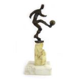 A bronze abstract sculpture depicting a footballer on a quartz-type pedestal and marble plinth,