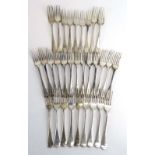 A mixed parcel of Georgian and later silver old English pattern dessert forks,