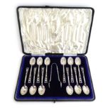A cased set of twelve Victorian silver teaspoons with shell bowls and openwork ends,
