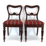 A set of four Victorian mahogany framed balloon back dining chairs