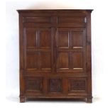 An early 18th century and later oak armoire, w.