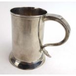 A George IV silver tankard of tapered cylindrical form, maker IK, London 1823, h. 12.