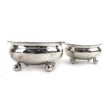 A pair of George III silver and parcel gilt salts, each of oval form on four bun feet, maker AH,