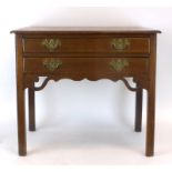 A George III oak lowboy, the shaped top over two frieze drawers, on square straight legs, w.