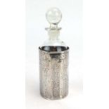 An Edwardian silver cologne bottle sleeve with rococo engraving and vacant cartouche,