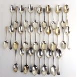 A mixed parcel of Georgian and later silver old English pattern dessert spoons,