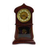 A late 19th/early 20th century mantle clock, the movement striking on a gong,