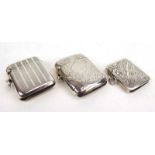A group of three early 20th century silver vesta cases, with engine turned and foliate engraving,