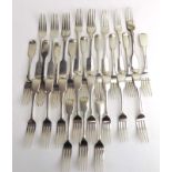 A mixed parcel of Georgian and later silver fiddle pattern table forks, various dates and makers,