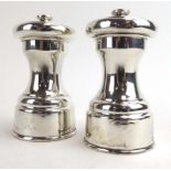 A pair of early 20th century silver pepper grinders of typical form, Hukin & Heath, London 1912, h.