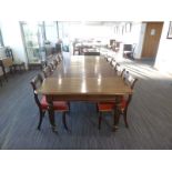 A William IV mahogany extending dining table with three fitted leaves on turned legs with castors,