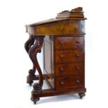 A Victorian figured walnut davenport of typical construction, w.