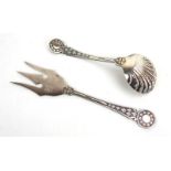 An early 20th century silver plated bread fork decorated with fruiting vines,