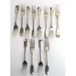 A mixed parcel of Georgian and later silver fiddle pattern dessert forks, various dates and makers,