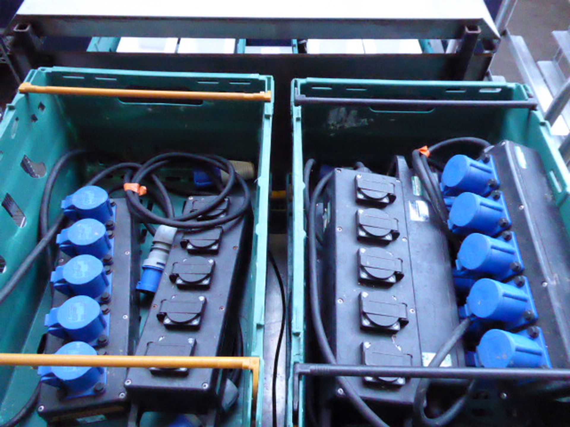 Four plastic trays containing a large quantity of blue commando 240V extension leads and several - Image 2 of 2