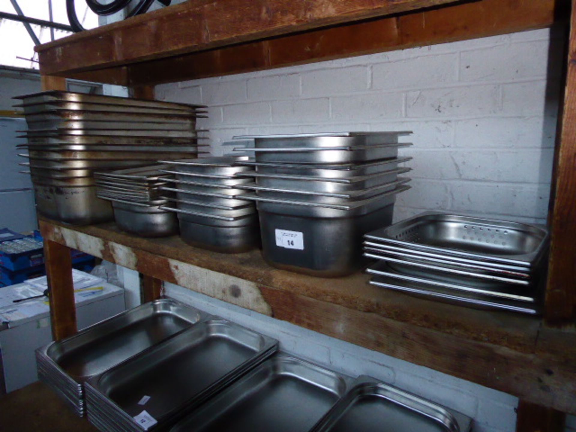 Bay of approximately ten stainless steel deep Gastronorm pans and approximately twenty half sized