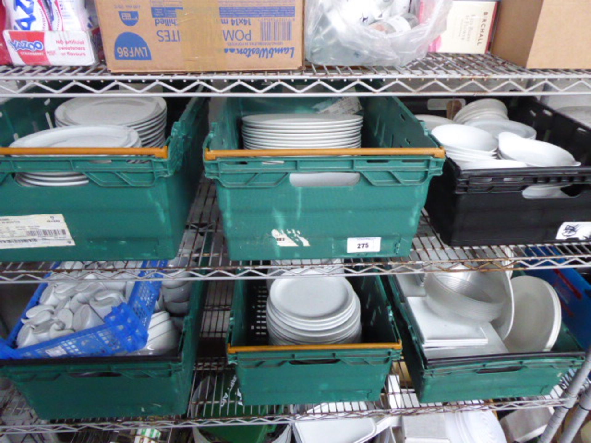 Six trays containing a variety of white crockery including large dinner plates, dinner plates,
