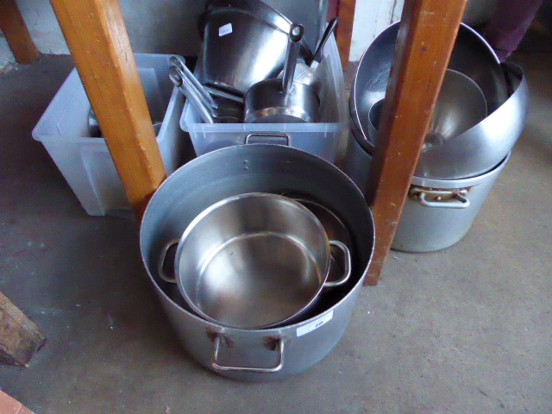 Bay of assorted aluminium and stainless steel cooking pots, saucepans, colanders, etc.