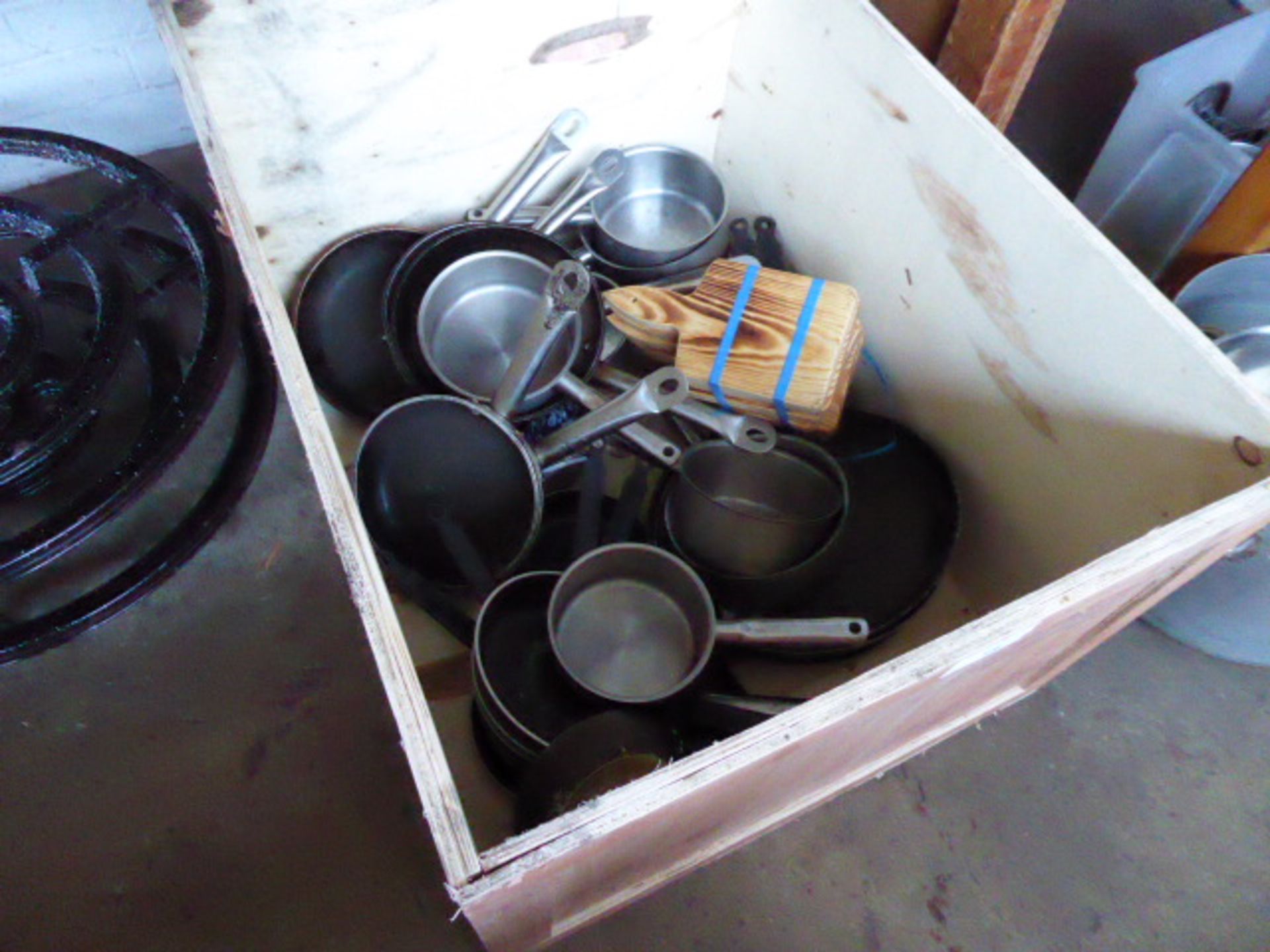 A box of assorted saucepans