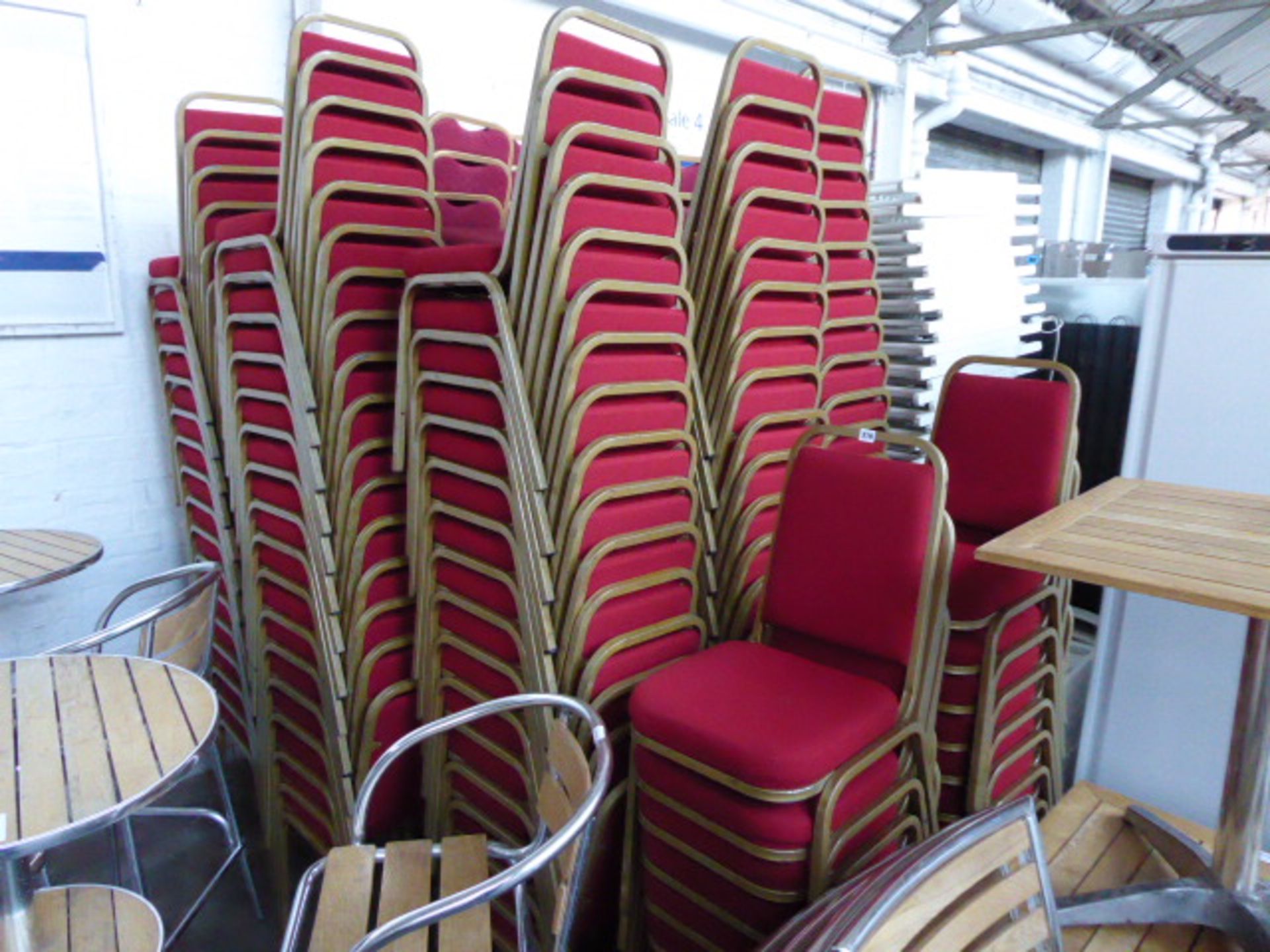 Large qty of metal frame red cloth stacking confrence/banquet chairs (approx. 154)