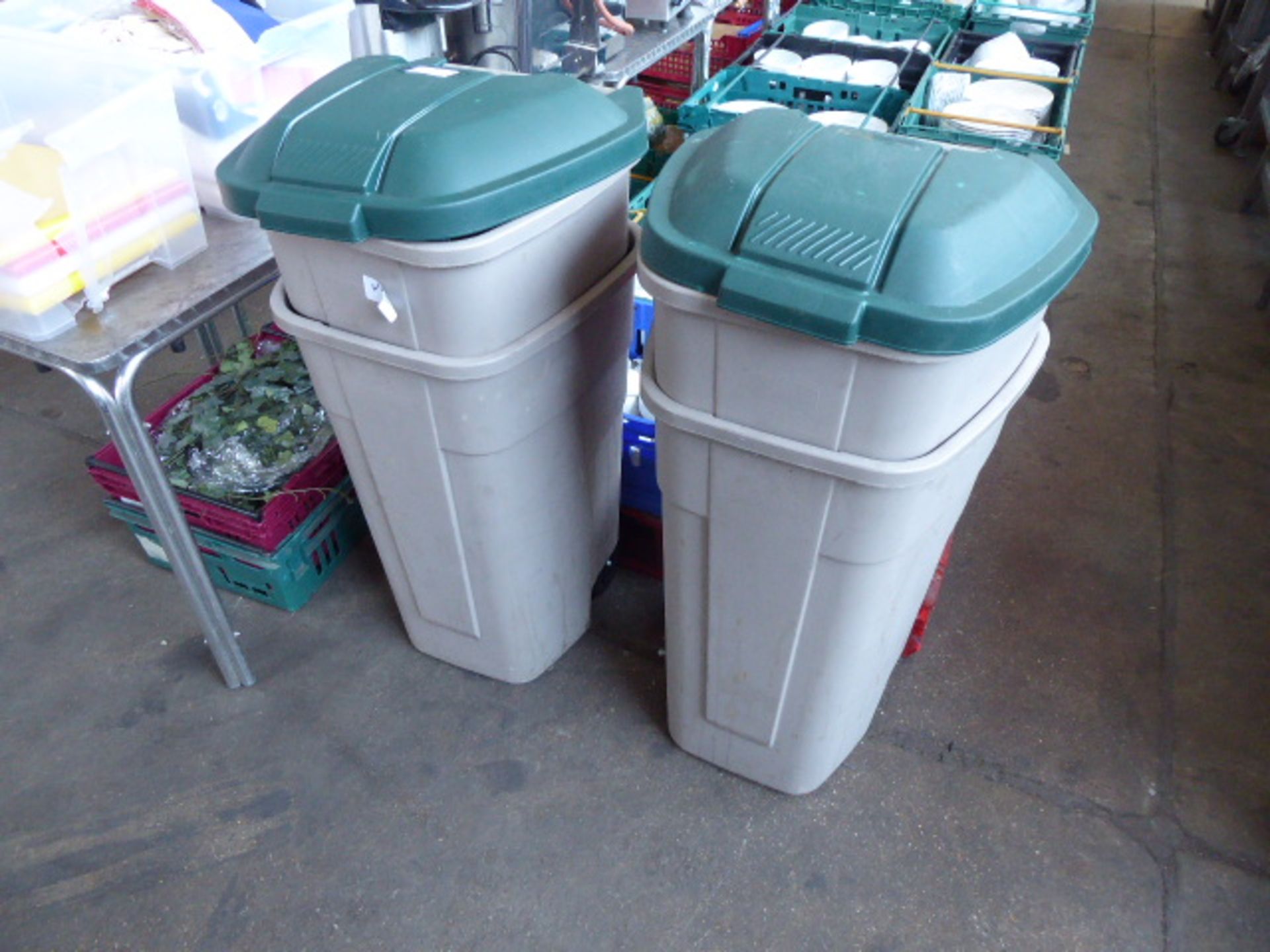 Four rubber made plastic kitchen wheelie bins