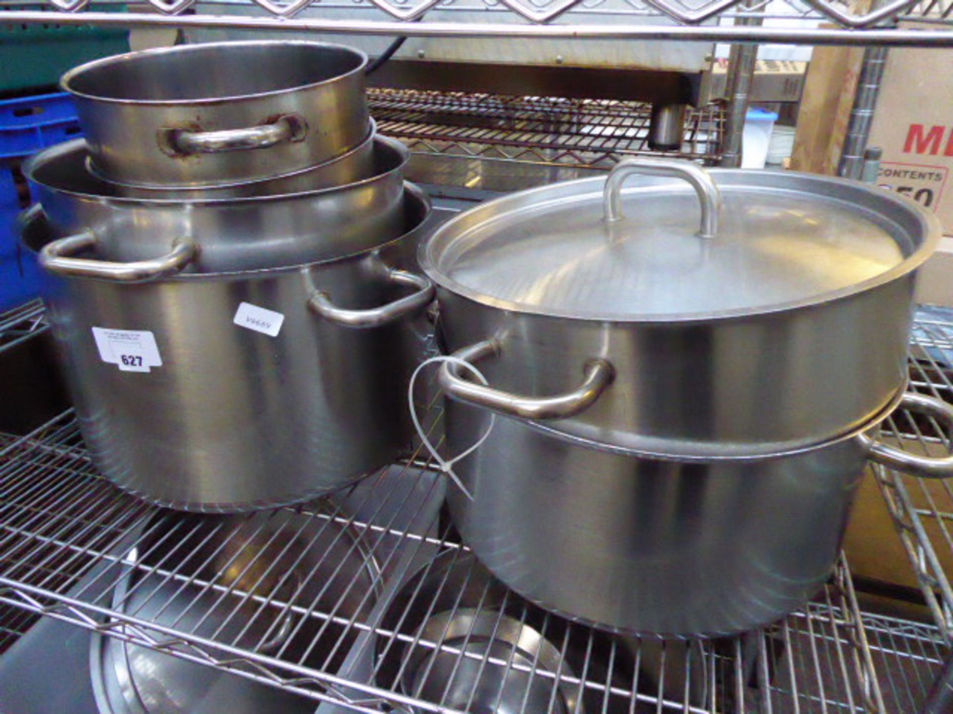 2 shelves of aluminum and stainless steel stock pots with handles and lids