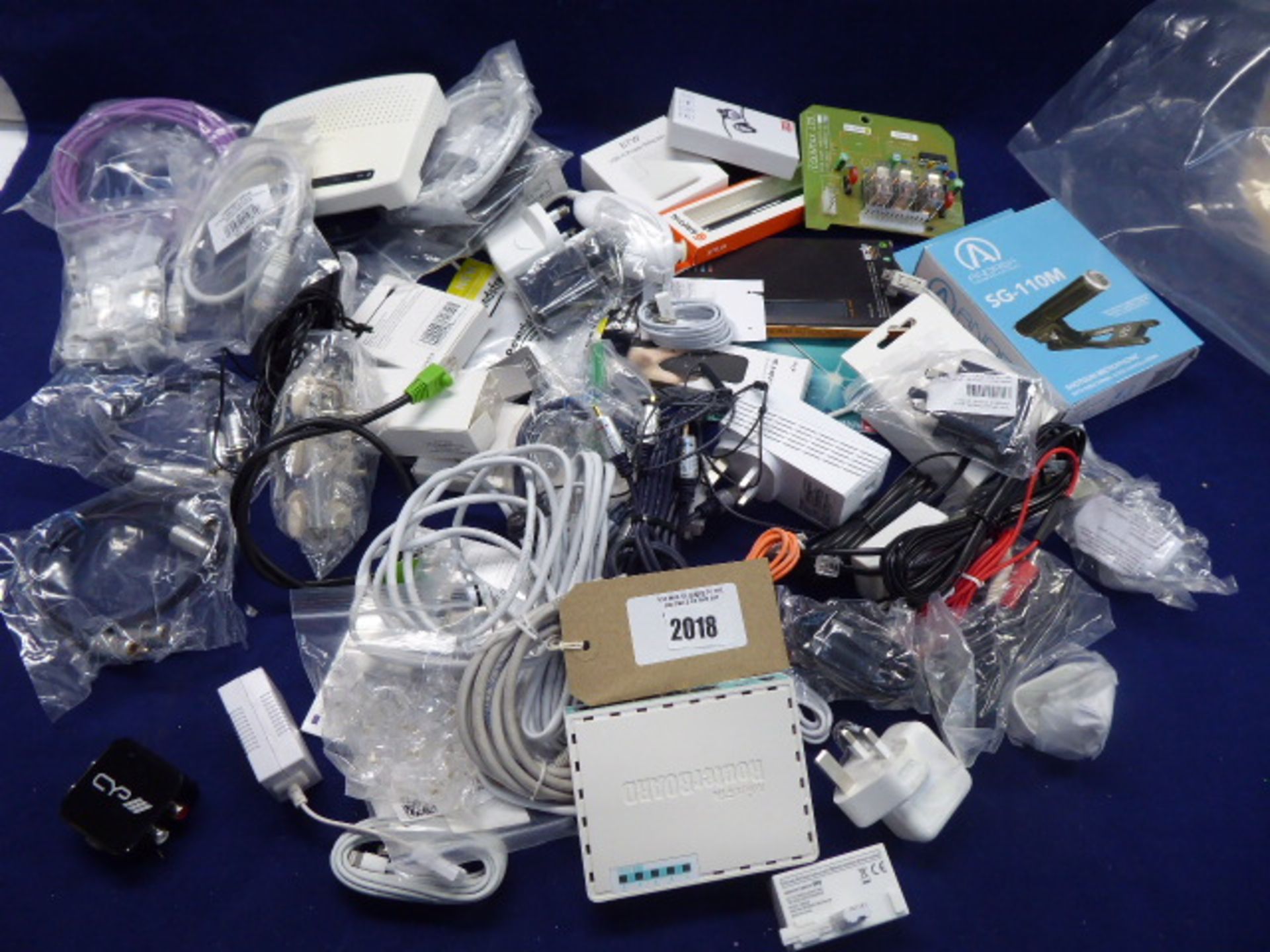 Bag containing various electrical accessories; adapters, wires, microphone, boards, routers etc