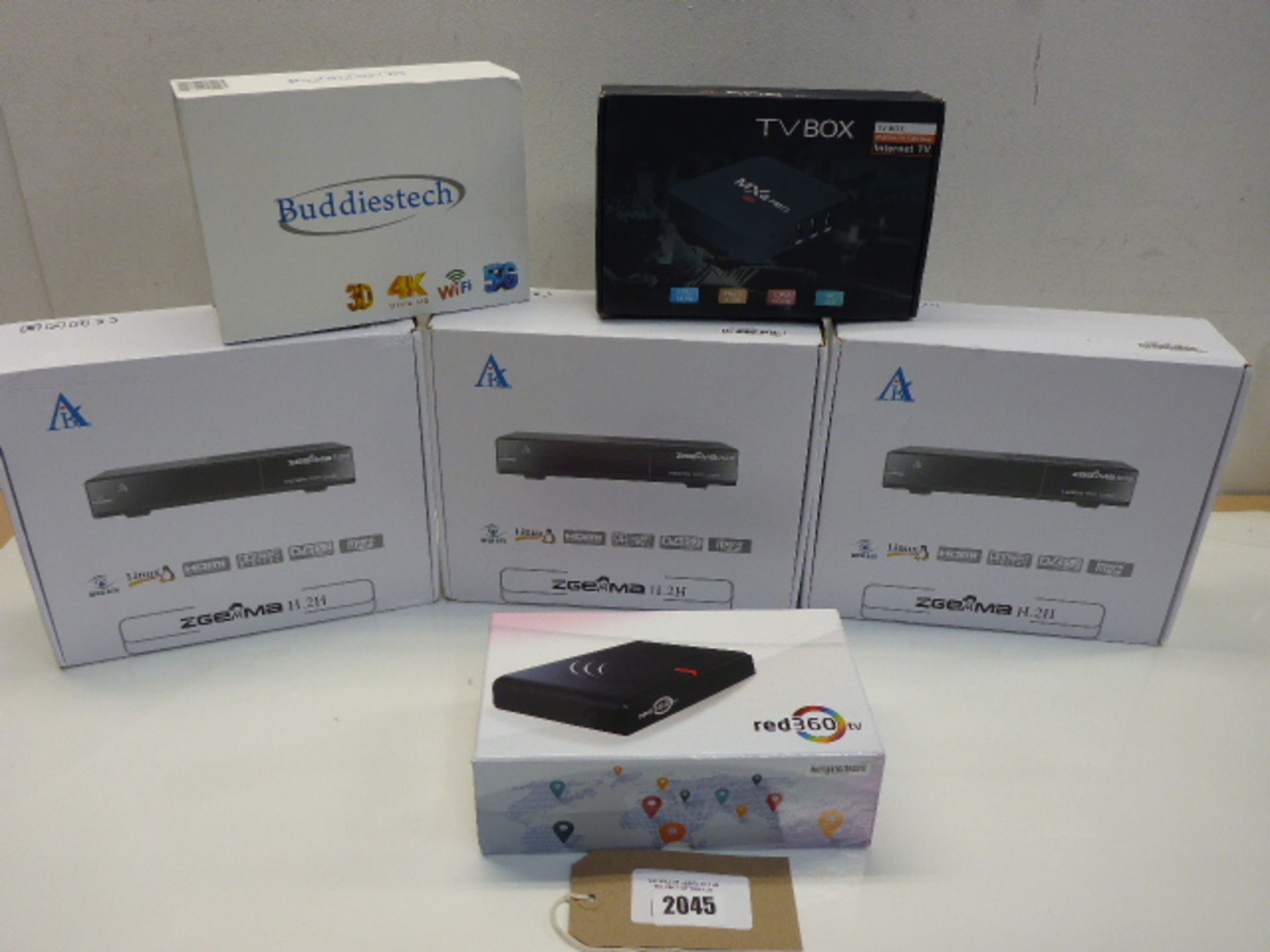 3 Android media boxes and 3 boxed satellite receiver kits.