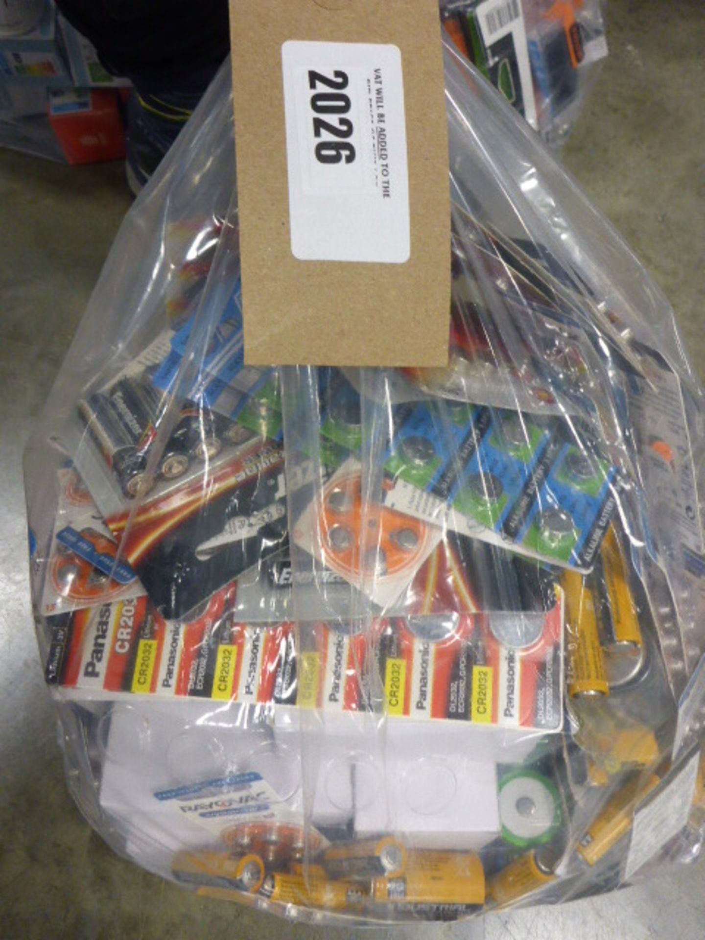 Bag containing quantity of various AAA, AA and button cell batteries