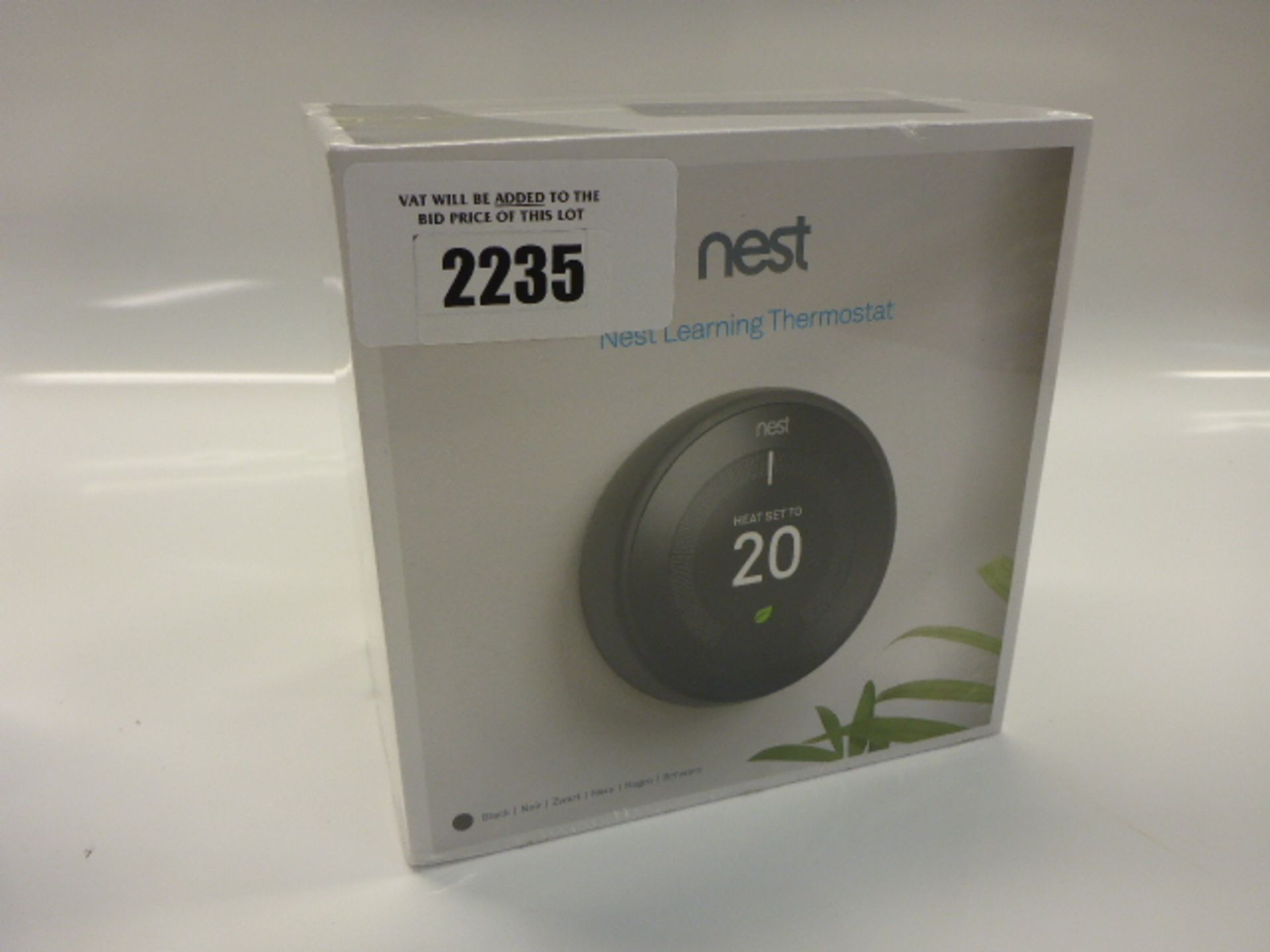 Nest learning thermostat in sealed box.
