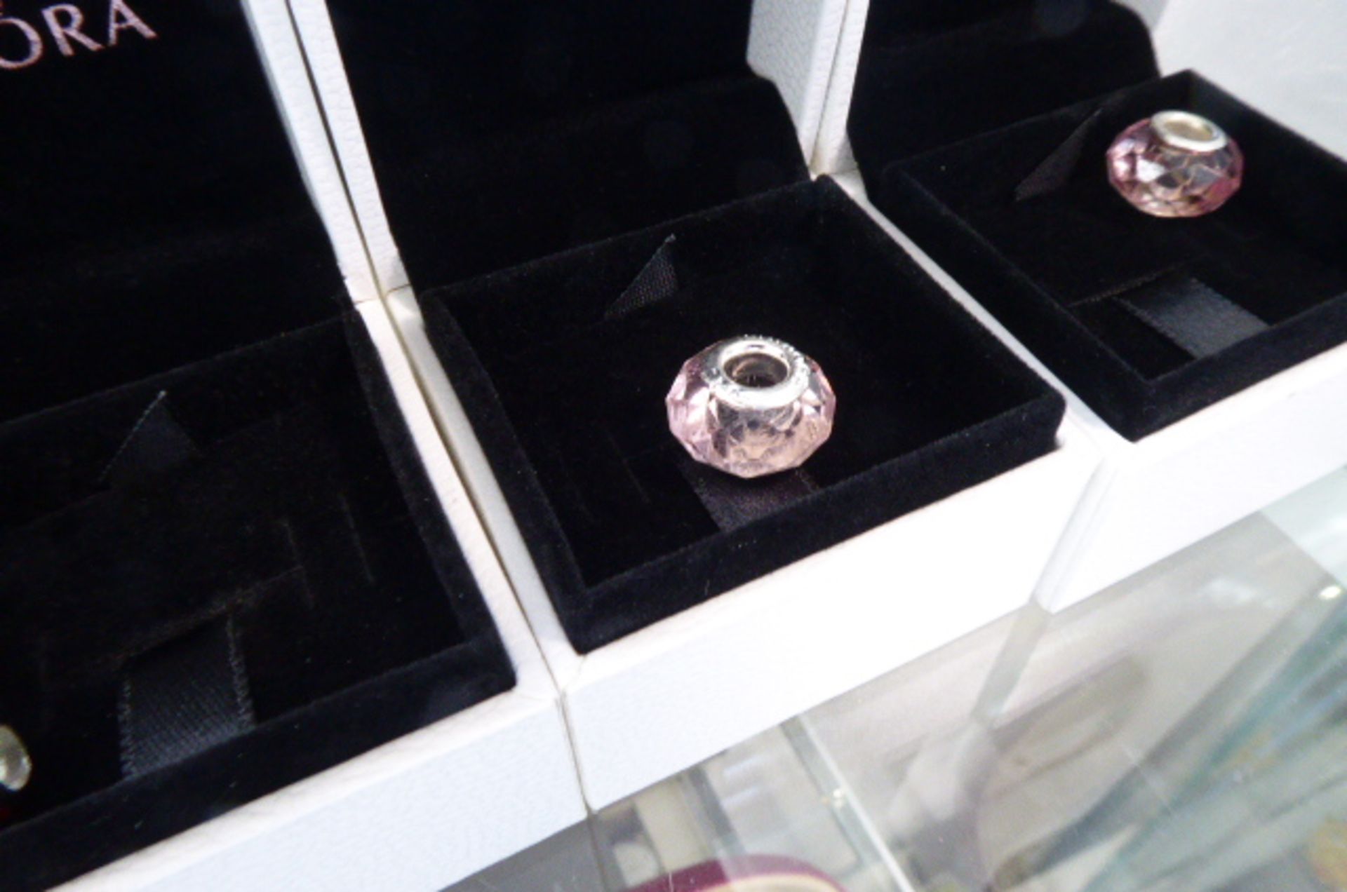 Clear pink coloured glass beads in Pandora charm boxes