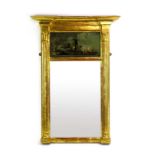 A giltwood wall mirror of Neo-Classical form, the rectangular plate below a painting on glass,