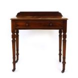 A Victorian mahogany side table, the two frieze drawers over turned legs on castors, w.