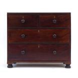 A 19th century mahogany chest of two short over two long drawers on bun feet, w.