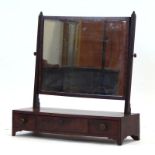 An early 19th century mahogany mirror,