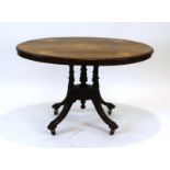 A 19th century loo table of oval form, the inlaid surface on turned supports,