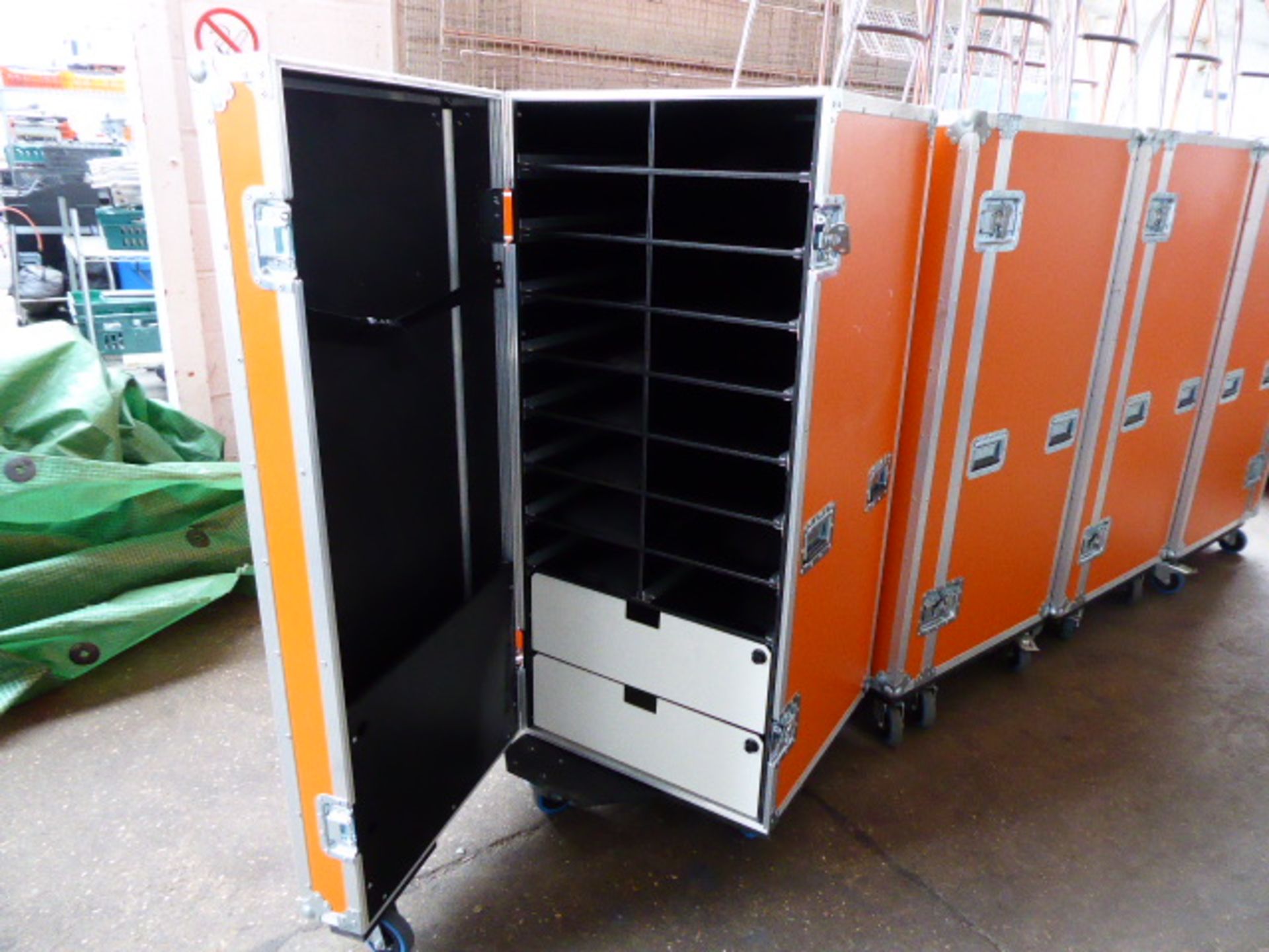 Trifibre Large orange and aluminum bound flight/logistics case on heavy duty castors fitted