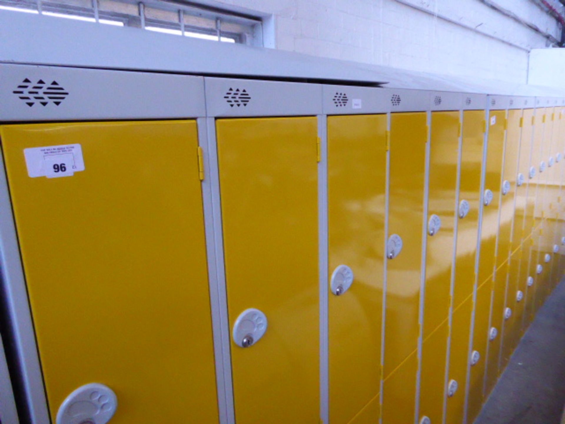 Four metal yellow and grey 6 door personal/school lockers each measuring 90cm wide (the majority