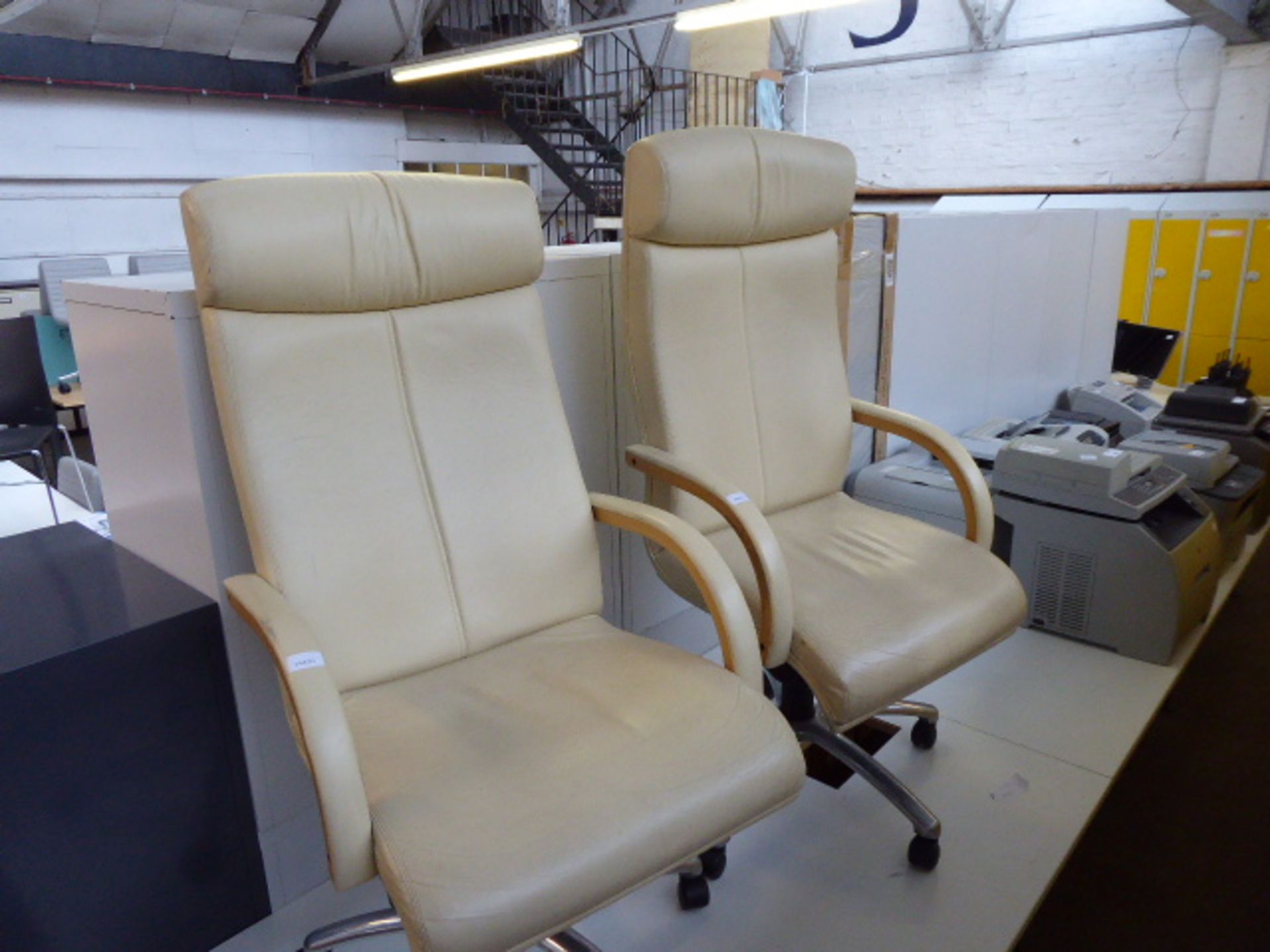 Two cream leather executive office armchairs