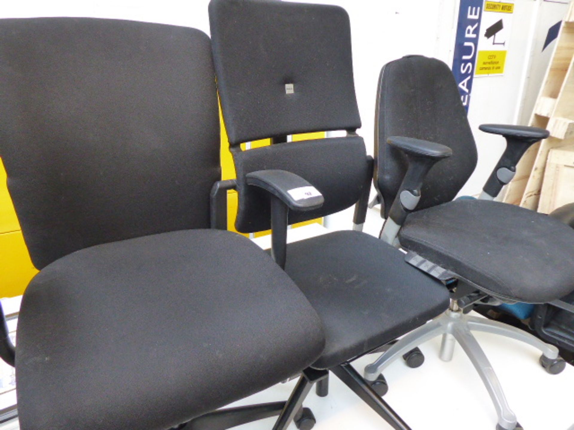 Seven assorted cloth office chairs