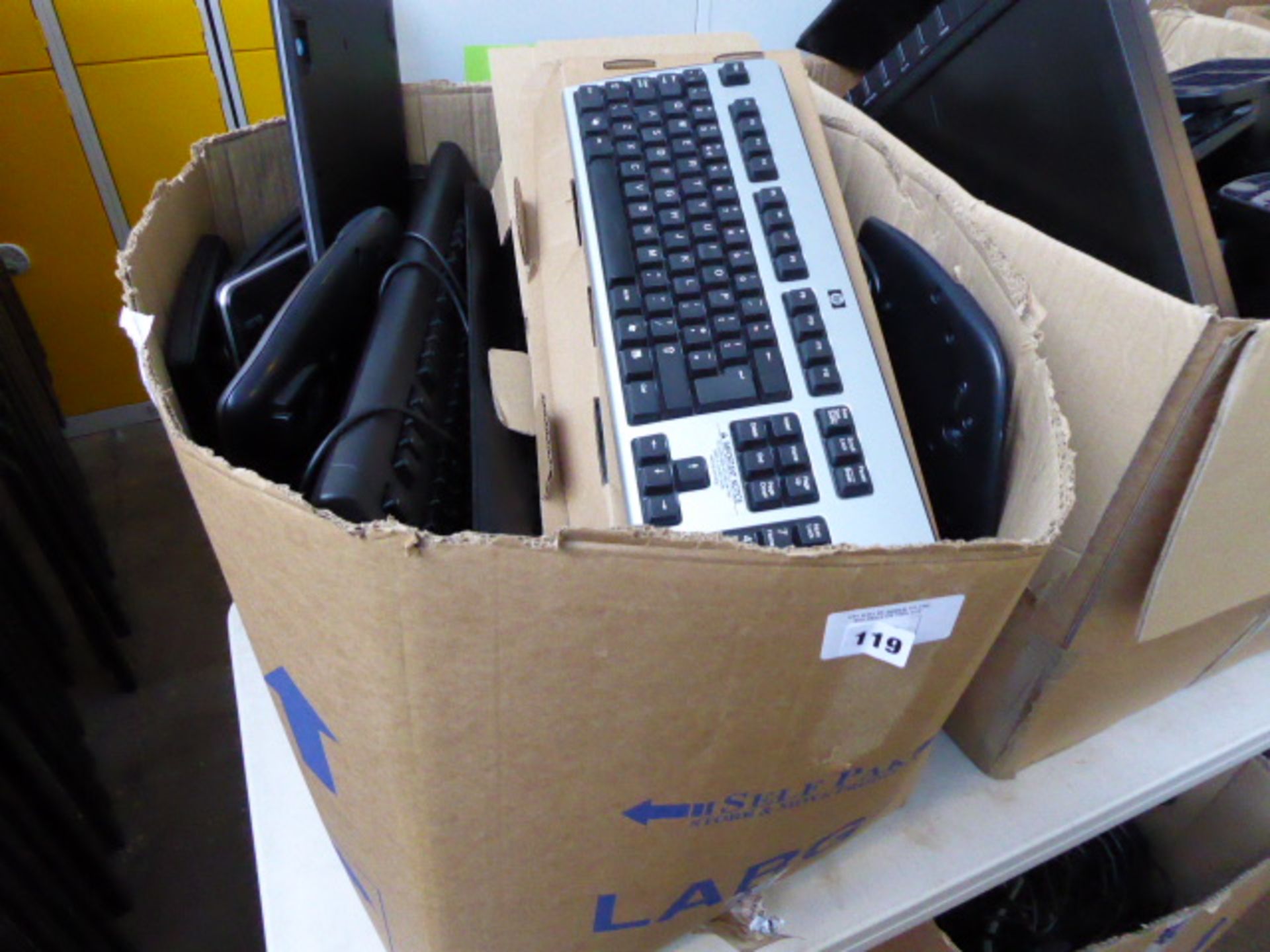 Large box of assorted keyboards and peripherals