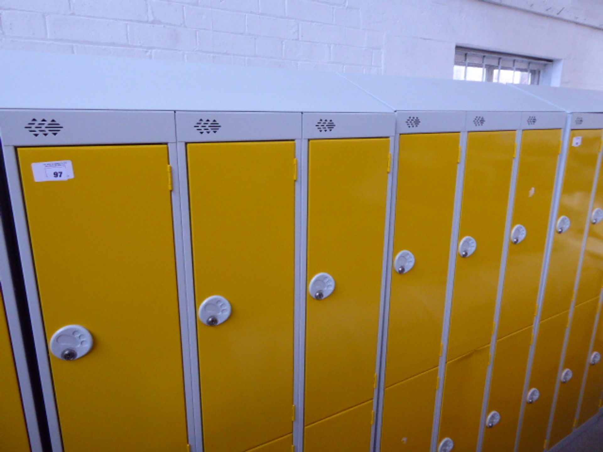 Four metal yellow and grey 6 door personal/school lockers each measuring 90cm wide (the majority